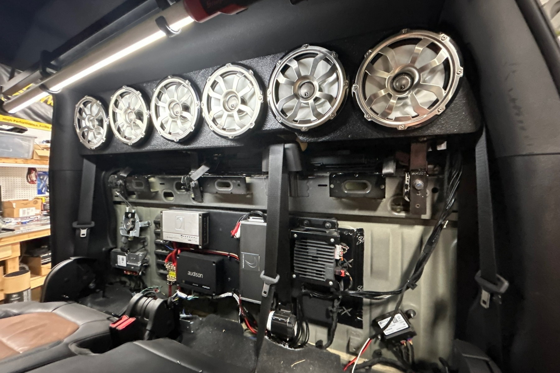 Door-panel pull, component speaker mounted, deadening behind — installed by Sturgess Customs