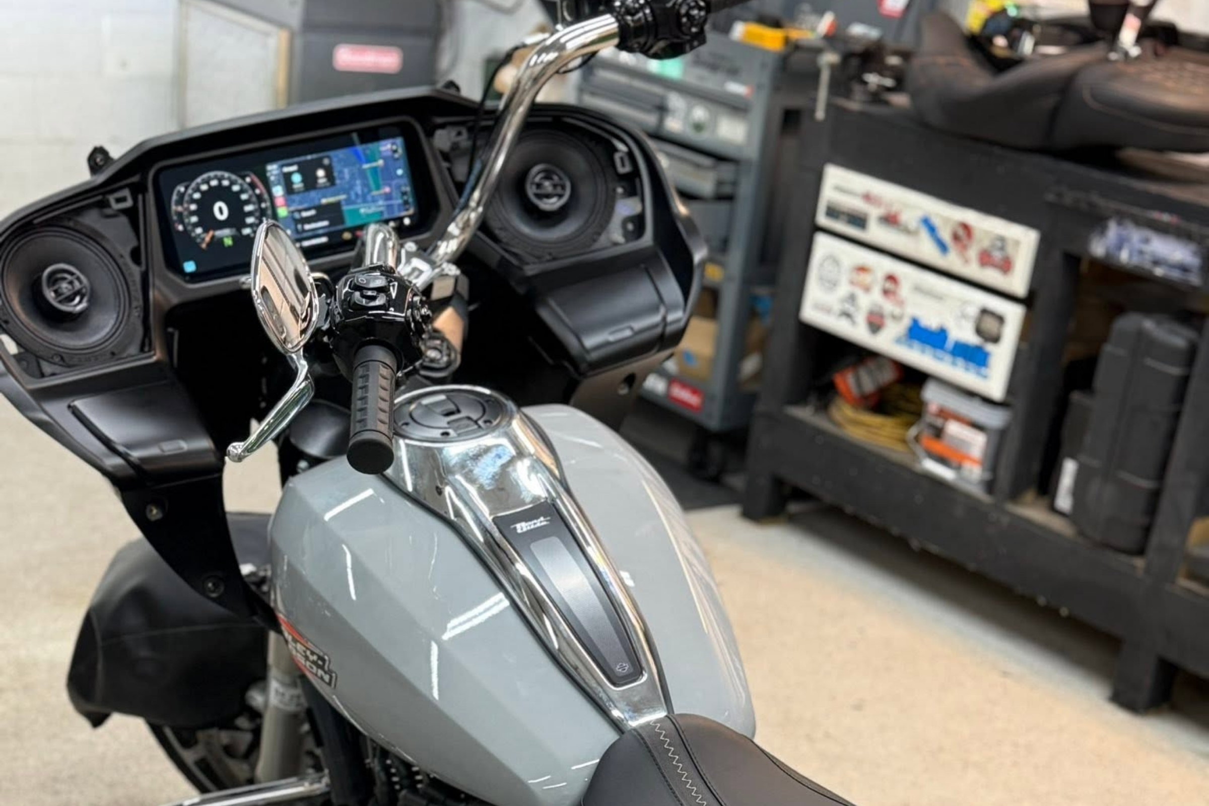 Boom! Box retained with upgrades, or clean aftermarket head unit at handlebar — installed by Sturgess Customs