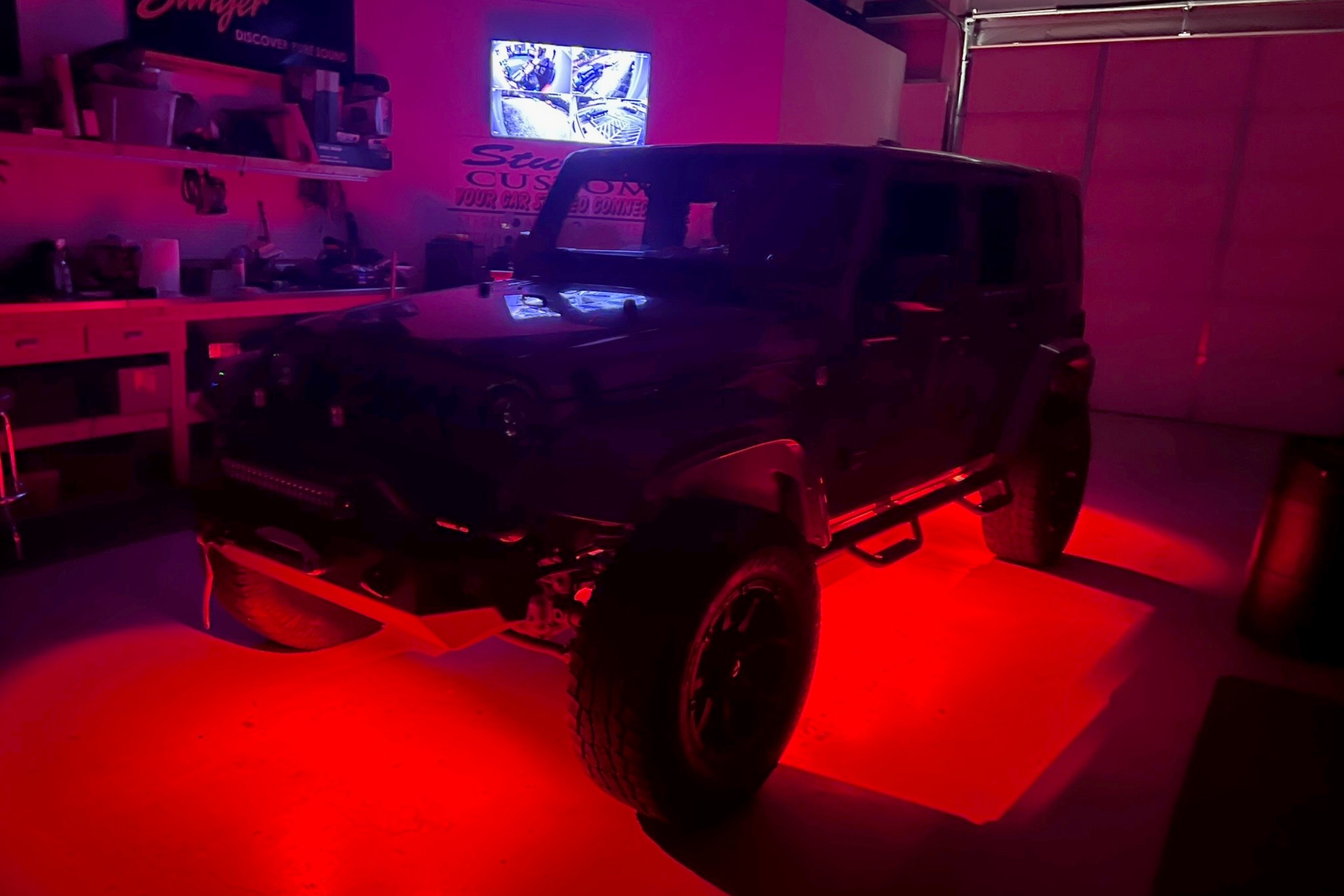 Jeep Wrangler with red exterior accent underglow lighting &mdash; installed by Sturgess Customs