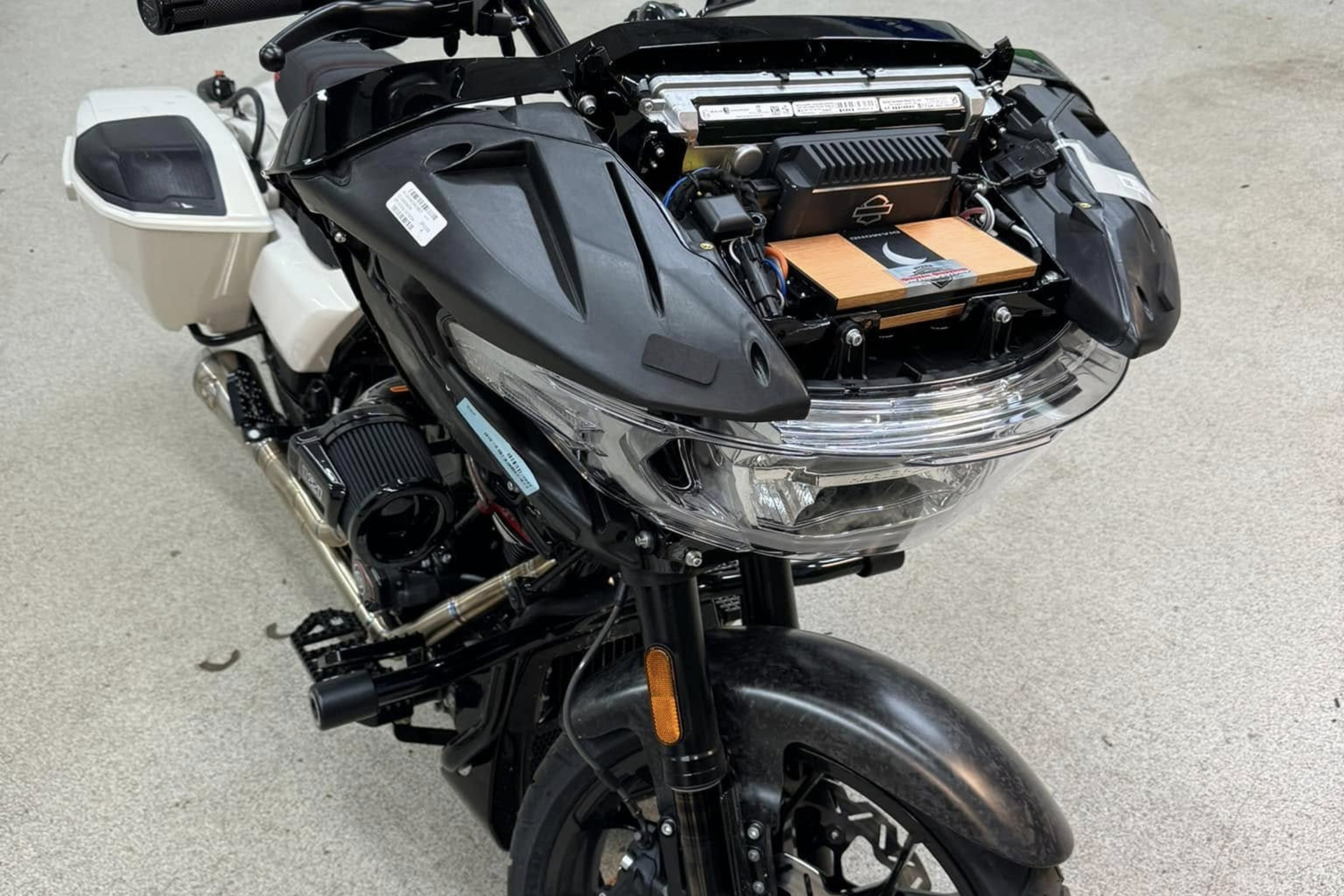 Amplifier placement and wiring on a motorcycle install — installed by Sturgess Customs