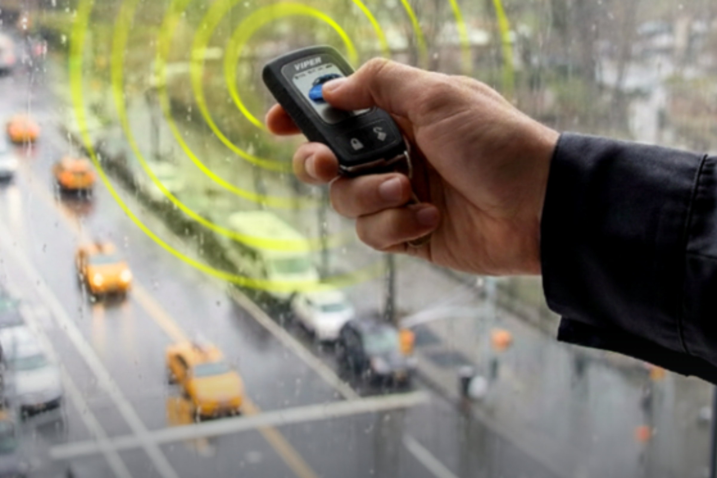 Customer using remote across a normal parking lot, daytime — installed by Sturgess Customs