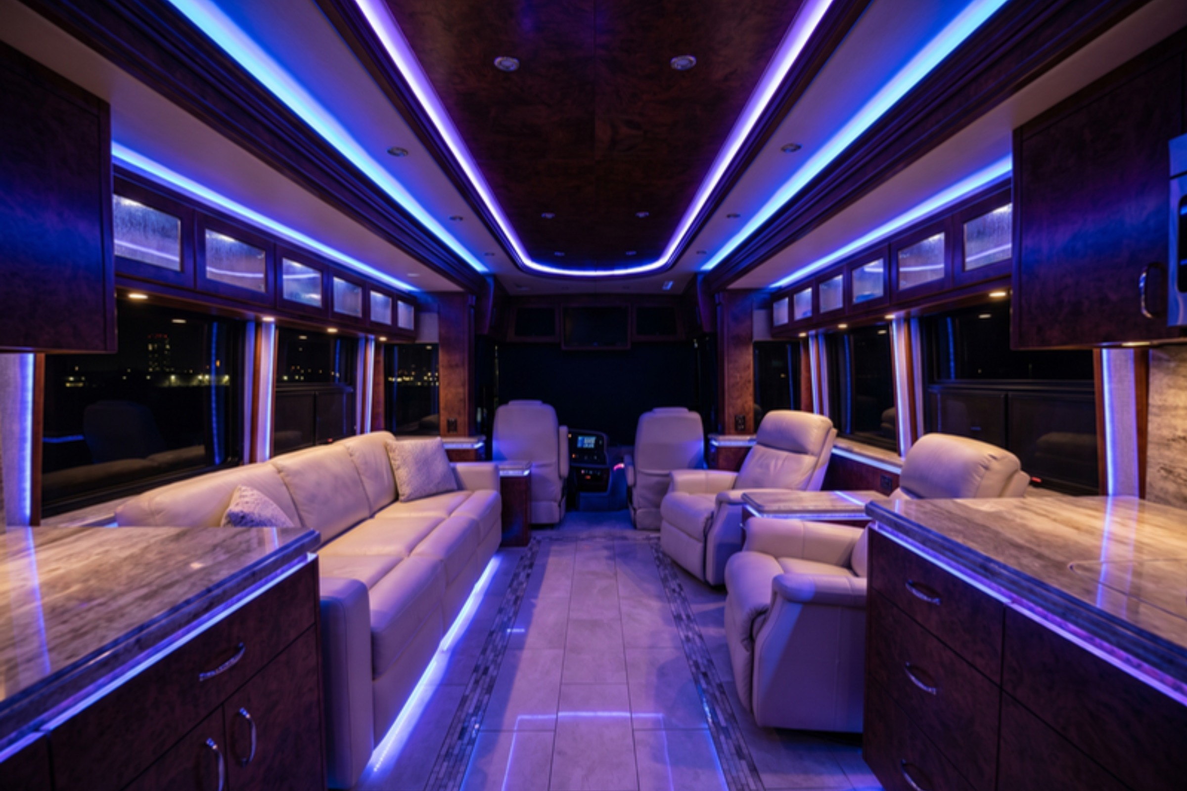 LED upgrade in real coach interior, daytime/evening comfort context — installed by Sturgess Customs